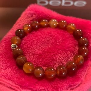 This is a bracelet I made , glass jasper beads . Made with wire wrap.